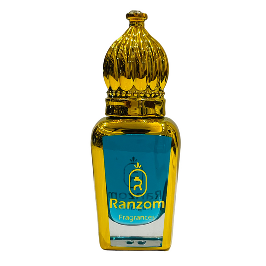 Gold and blue bottle of Ranzom Fragrances on a white surface with a gray background